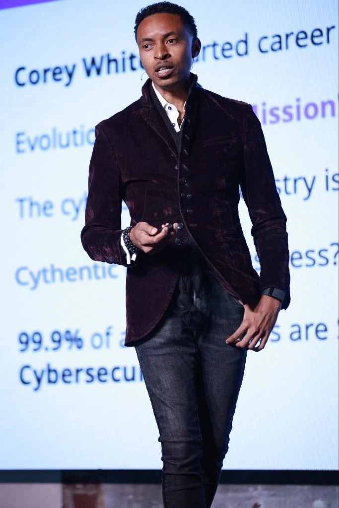 Corey White on stage delivering a cybersecurity keynote